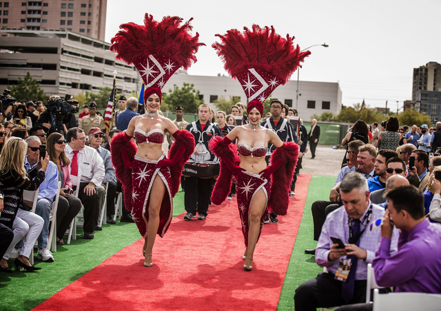 Showgirls lead a procession with the Coronado High School Band and dignitaries Thursday, April 7, 2016 during the groundbreaking for Project Neon near The Smith Center for the Performing Arts in L ...