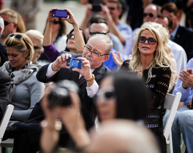 Myron Martin, president and CEO of the Smith Center for the Performing Arts, takes a photo during the groundbreaking for Project Neon, near the venue in Las Vegas on Thursday, April 7, 2016. Jeff  ...