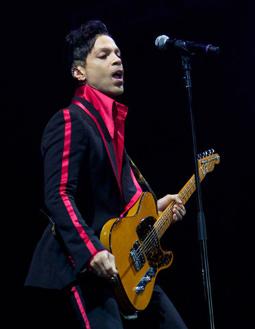 FILE - In this Nov. 14, 2010 file photo, musician Prince performs in Yas Island, on the final night of the F1 motor race meeting in Abu Dhabi, United Arab Emirates. Prince's publicist has confirme ...
