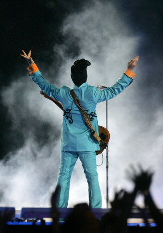 FILE - In this Feb. 4, 2007 file photo, Prince performs during the halftime show at Super Bowl XLI at Dolphin Stadium in Miami. Prince's publicist has confirmed that Prince died at his home in Min ...