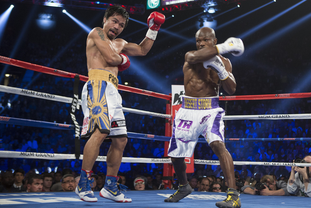 Manny Pacquiao, left, battles against Timothy Bradley in the WBO International welterweight championship boxing bout at the MGM Grand Garden ArenaSaturday, April 9, 2016, in Las Vegas. Pacquiao wo ...