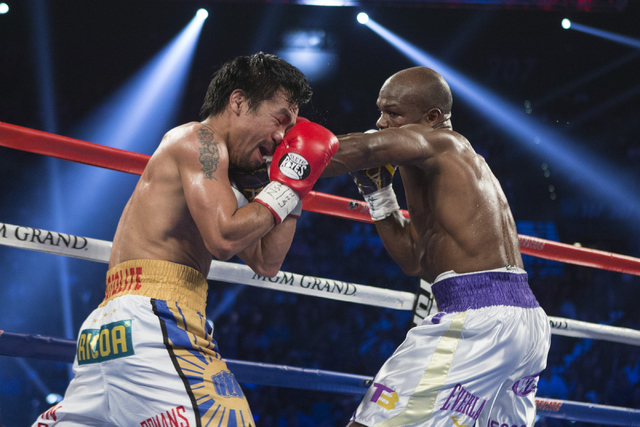 Manny Pacquiao, left, battles against Timothy Bradley in the WBO International welterweight championship boxing bout at the MGM Grand Garden ArenaSaturday, April 9, 2016, in Las Vegas. Pacquiao wo ...