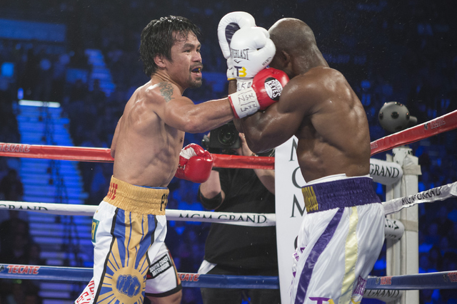 Manny Pacquiao, left, connects a right punch for a knockdown against Timothy Bradley in the WBO International welterweight championship boxing bout at the MGM Grand Garden ArenaSaturday, April 9,  ...