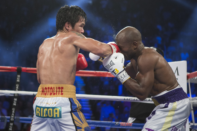 Manny Pacquiao, left, connects a right punch against Timothy Bradley in the WBO International welterweight championship boxing bout at the MGM Grand Garden ArenaSaturday, April 9, 2016, in Las Veg ...
