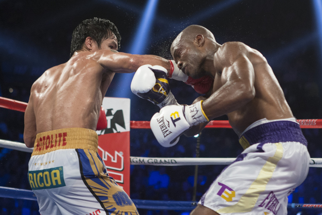 Manny Pacquiao, left, connects a right punch against Timothy Bradley in the WBO International welterweight championship boxing bout at the MGM Grand Garden ArenaSaturday, April 9, 2016, in Las Veg ...