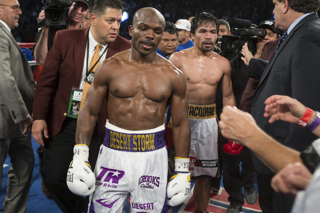Timothy Bradley, left, and Manny Pacquiao walk in the ring at the end of their WBO International welterweight championship boxing bout at the MGM Grand Garden ArenaSaturday, April 9, 2016, in Las ...