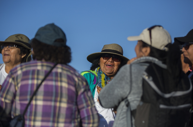 Iris Daboda shares a laugh with friends before the start of the Gold Butte Culture Walk, Saturday, April 23, 2016, in Gold Butte, Nevada. The fourth annual event is aimed at promoting the need for ...