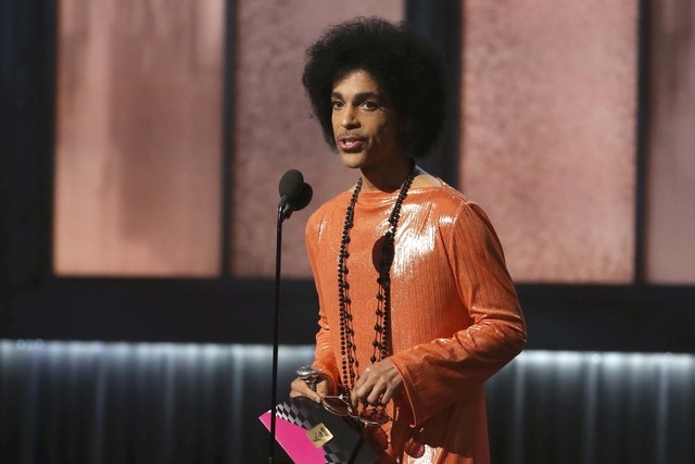 Prince presents the award for album of the year at the 57th annual Grammy Awards in Los Angeles, Feb. 8, 2015. (Lucy Nicholson/Reuters)