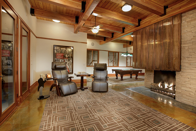 The game room has a fireplace. (Synergy Sotheby's International Realty)