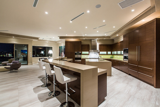The kitchen has a large island with seating. (Courtesy Shapiro & Sher Group)