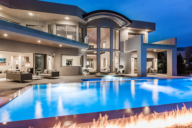 The home features a large pool with a fire feature.  (Courtesy Shapiro & Sher Group)