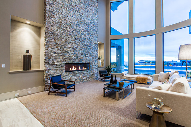 The living room features a horizontal fireplace. (Courtesy Shapiro & Sher Group)