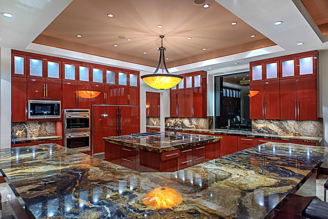 The kitchen has a center island. (Courtesy Simply Vegas)