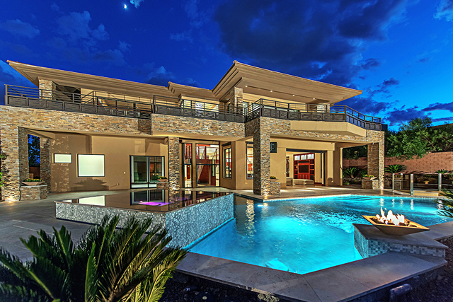The home's backyard has a pool, spa and fire feature. (Courtesy Simply Vegas)