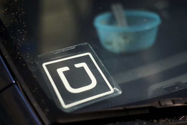 An Uber car is seen parked with the driver's lunch left on the dashboard in Venice, Los Angeles, California, United States July 15, 2015. (Lucy Nicholson/Reuters)