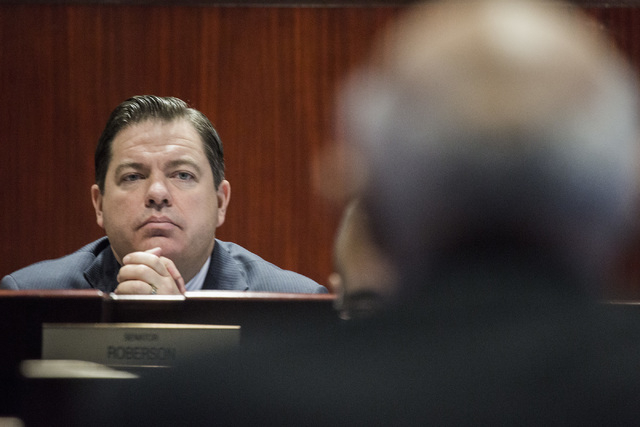Nevada Senate Majority Leader Michael Roberson, R-Henderson, listens to education consultant Michael Strembitsky during a legislative committee hearing on reorganizing the Clark County School Dist ...