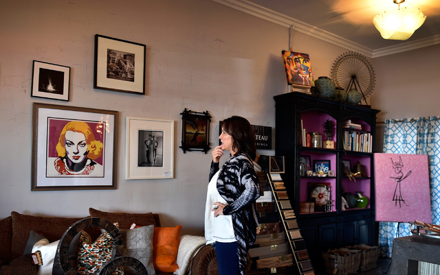 Interior designer Jill Abelman ponders an artist's work in her showroom at her Inside Style offices in downtown Las Vegas Friday, March 25, 2016. David Becker/Las Vegas Review-Journal Follow @davi ...