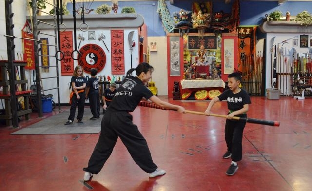 Yuko Brazil works with Ethan Young, 11, at the Lohan School of Shaolin, 3850 Schiff Drive. Ginger Meurer/Special to View