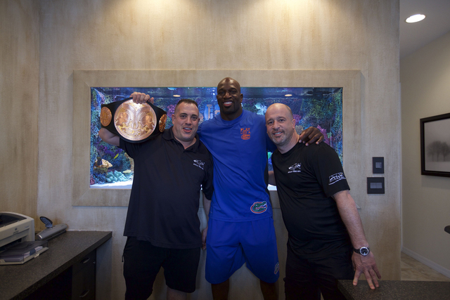 Wayde and Brett with Titus O'Neil in front of his new Florida Gator themed tank. (Courtesy Animal Planet)