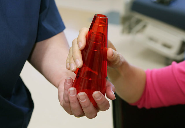 Therapy cones are handled and passed during a demonstration in Pima Medical Institute's Occupational Therapy Assistant program classroom Friday, April 1, 2016, in Las Vegas.  (Ronda Churchill/Las  ...
