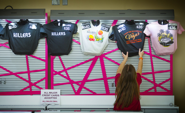A woman places The Killers t-shirts in a booth at T-Mobile Arena on Wednesday, April 6, 2016. Jeff Scheid/Las Vegas Review-Journal Follow @jlscheid