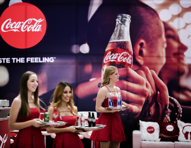 Coca-Cola servers hold drinks for dignitaries and guests at Toshiba Plaza on Wednesday, April 6, 2016. Jeff Scheid/Las Vegas Review-Journal Follow @jlscheid