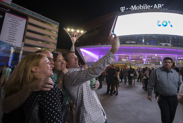 Jaime Henneman, from left, Dave Dirken and Mike and Shannon Reiter pose for a photo outside T-Mobile Arena during opening night of the new Las Vegas entertainment venue, Wednesday, April 6, 2016.  ...