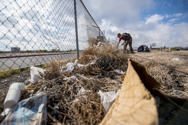 James Fouts picks up garbage during the cleanup of the newly acquired UNLV site off of Tropicana Avenue east of Koval Lane in Las Vegas on Saturday, April 9, 2016.  (Joshua Dahl/Las Vegas Review-J ...