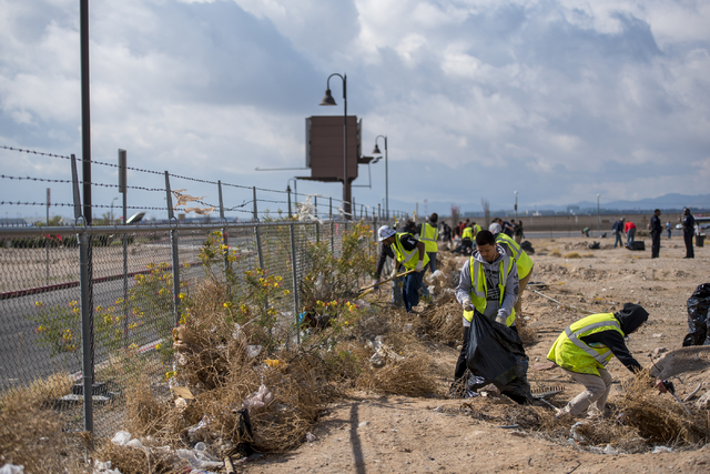 Volunteers pick up garbage during the cleanup of the newly acquired UNLV site off of Tropicana Avenue east of Koval Lane in Las Vegas on Saturday, April 9, 2016. (Joshua Dahl/Las Vegas Review-Journal)