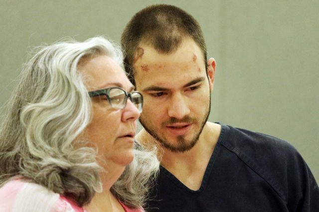 Skyler Fowler, 26, right, confers with public defender Christy ...