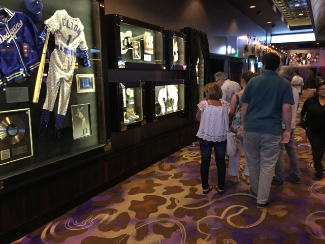 Tourists walk past a display of Prince memorabilia at the Hard Rock hotel-casino at 4455 Paradise Road in Las Vegas on Thursday, April 21, 2016. (Greg Haas/Las Vegas Review-Journal) Follow @RJgreg09