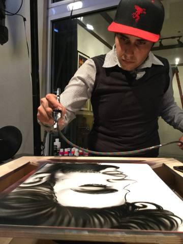 Artist Jose Colon airbrushes a portrait of Prince at the Linq Promenade in Las Vegas on Thursday, April 21, 2016. Prince died Thursday at his Minnesota home. (Greg Haas/Las Vegas Review-Journal) F ...