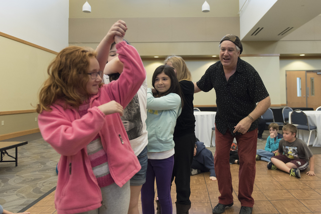 Bruce Bierman, right, teaches children how to &quot;Shtok&quot; dance during the Moving Stories! class at Yiddish Las Vegas: A Music & Culture Festival at Temple Sinai in Las Vegas Sun ...