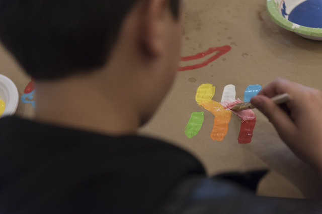 A child paints a character during a collaborative art project at Yiddish Las Vegas: A Music & Culture Festival at Temple Sinai in Las Vegas Sunday, April 10, 2016. Jason Ogulnik/Las Vegas Revi ...