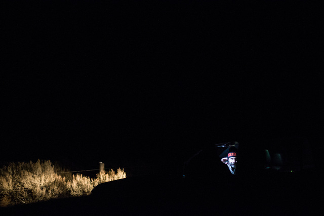 Conservative radio host Pete Santilli, shown through the passenger window of a truck, talks with an anti-government protestor by the entrance of Malheur National Wildlife Refuge near Burns, Ore. o ...