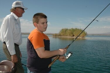 Former professional bass angler, Gary Thien, left his fishing rod on the deck to concentrate his teaching efforts on Hyrum Nielsen at Lake Havasu. (Doug Nielsen/Special To Las Vegas Review-Journal)
