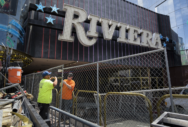 Workers from All-Star Fence assemble the perimeter surrounding the iconic Riviera Hotel & Casino in Las Vegas, which closed on Monday, May 4, 2015 after 60 years. (Mark Damon/Las Vegas News Bu ...