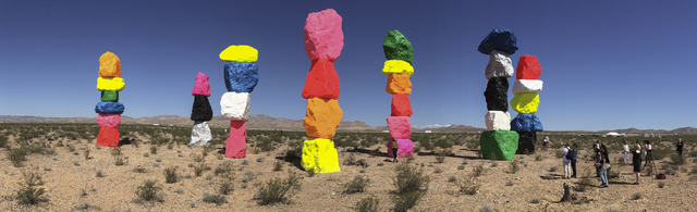 Seven Magic Mountains -- a large-scale, site-specific public artwork by the artist Ugo Rondinone -- is seen in a panorama photo looking west near the Jean Dry Lake south of Las Vegas on Monday, Ma ...