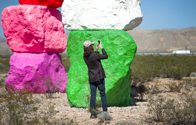 David Walker, executive director of the Nevada Museum of Art takes a photo as the museum and Art Production Fund celebrate the opening of Seven Magic Mountains near the Jean Dry Lake south of Las  ...