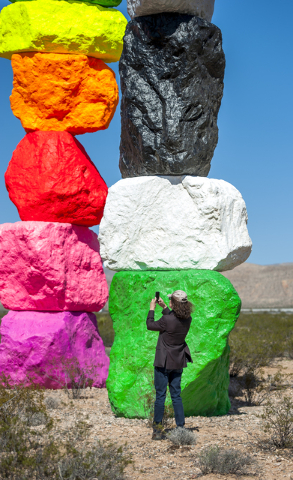 David Walker, executive director of the Nevada Museum of Art takes a photo as the museum and Art Production Fund celebrate the opening of Seven Magic Mountains -- a large-scale, site-specific publ ...
