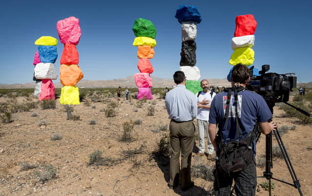 Artist Ugo Rondinone, center, is interviewed as Art Production Fund and the Nevada Museum of Art celebrate the opening of Seven Magic Mountains -- Rondinone's large-scale, site-specific public art ...