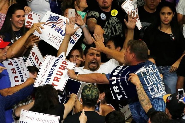 A protester disrupts a rally with Republican U.S. presidential candidate Donald Trump and his supporters in Albuquerque, New Mexico, U.S. May 24, 2016. (Jonathan Ernst/Reuters)