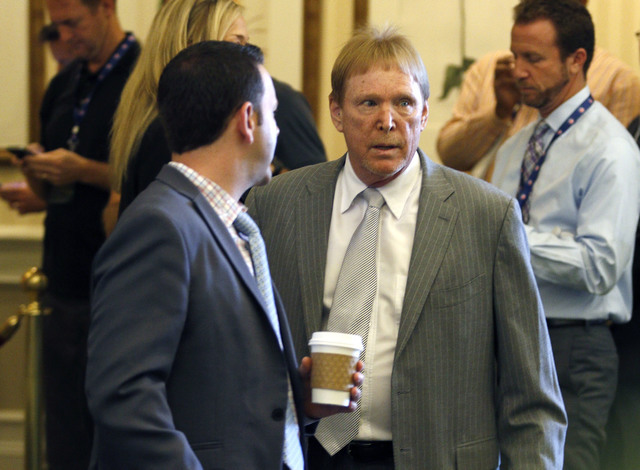 Oakland Raiders owner Mike Davis, right, makes his way into the NFL owner's meeting in Charlotte N.C., Tuesday, May 24, 2016. (Bob Leverone/AP)