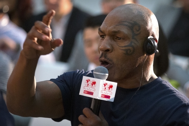 Former heavyweight boxing champion Mike Tyson speaks during a panel discussion held before the 2016 IBF World Championship Bout at the National Tennis Center in Beijing, Wednesday, May 25, 2016. ( ...