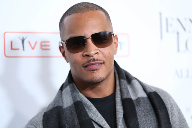 FILE- In this Jan. 20, 2016, file photo, T.I. arrives at the grand opening of &quot;Jennifer Lopez: All I Have&quot; show at Planet Hollywood Resort & Casino in Las Vegas. According to ...