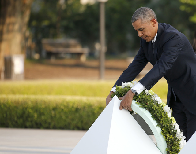 U.S. President Barack Obama lays a wreath at Hiroshima Peace Memorial Park in Hiroshima, western, Japan, Friday, May 27, 2016. Obama on Friday became the first sitting U.S. president to visit the ...