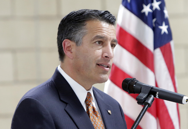 Gov. Brian Sandoval speaks during a homecoming ceremony for the Nevada Army National Guard's 72nd Military Police Company at North Las Vegas Readiness Center Friday, 13, 2016. Bizuayehu Tesfaye/La ...