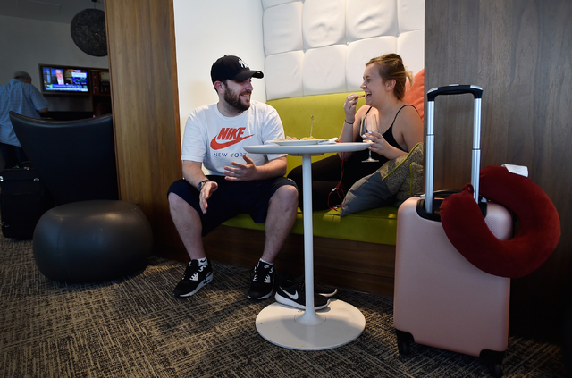 Josh Neighoff, left, and Samantha Bowers relax in one of the cubbies at The Centurion Lounge at McCarran International Airport Monday, May 16, 2016, in Las Vegas. The American Express members were ...
