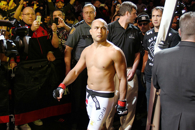 BJ Penn enters the Octagon for a match against Rory MacDonald prior to their mixed martial arts bout at a UFC on FOX 5 event in Seattle, Saturday, Dec. 8, 2012.  (AP Photo/Gregory Payan)