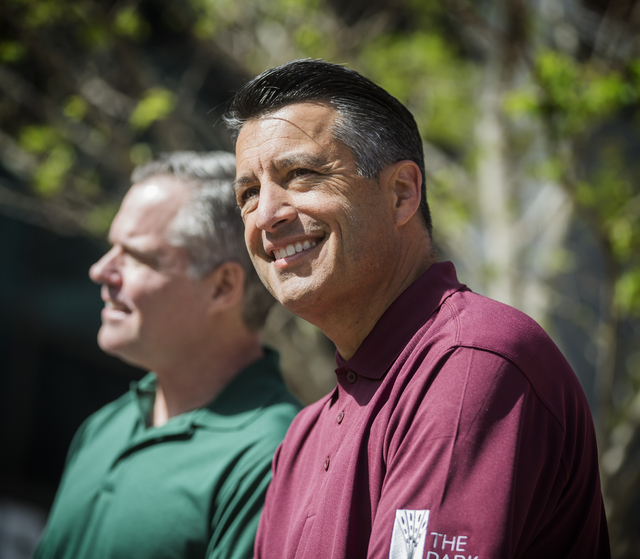Jim Murren,left,  chairman and CEO of MGM Resorts International, and Nevada Gov. Brian Sandoval sit during a grand opening party at The Park on Monday, April 4, 2016. ( Jeff Scheid/Las Vegas Revie ...